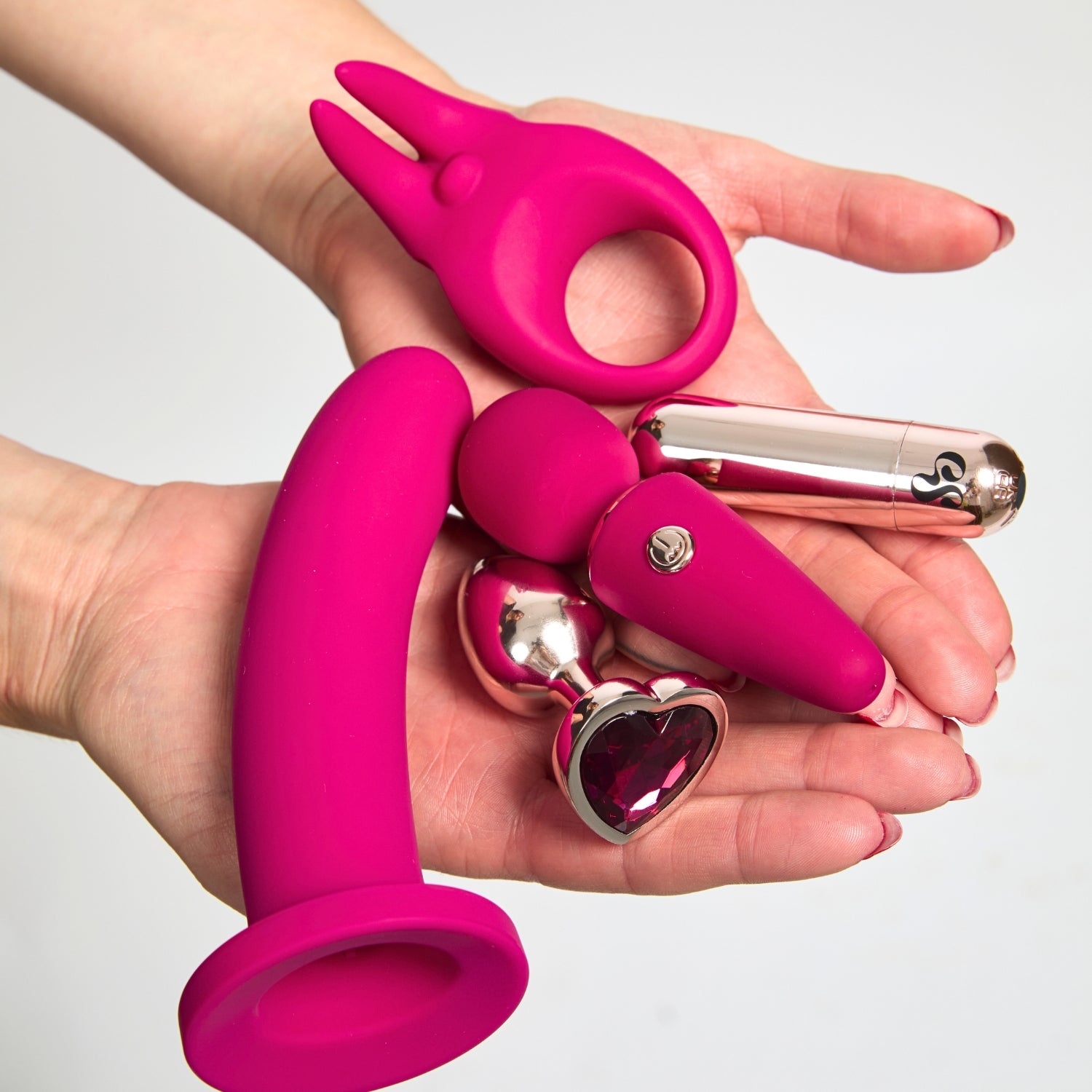 hands holding 7 Nights of Delight sex toys