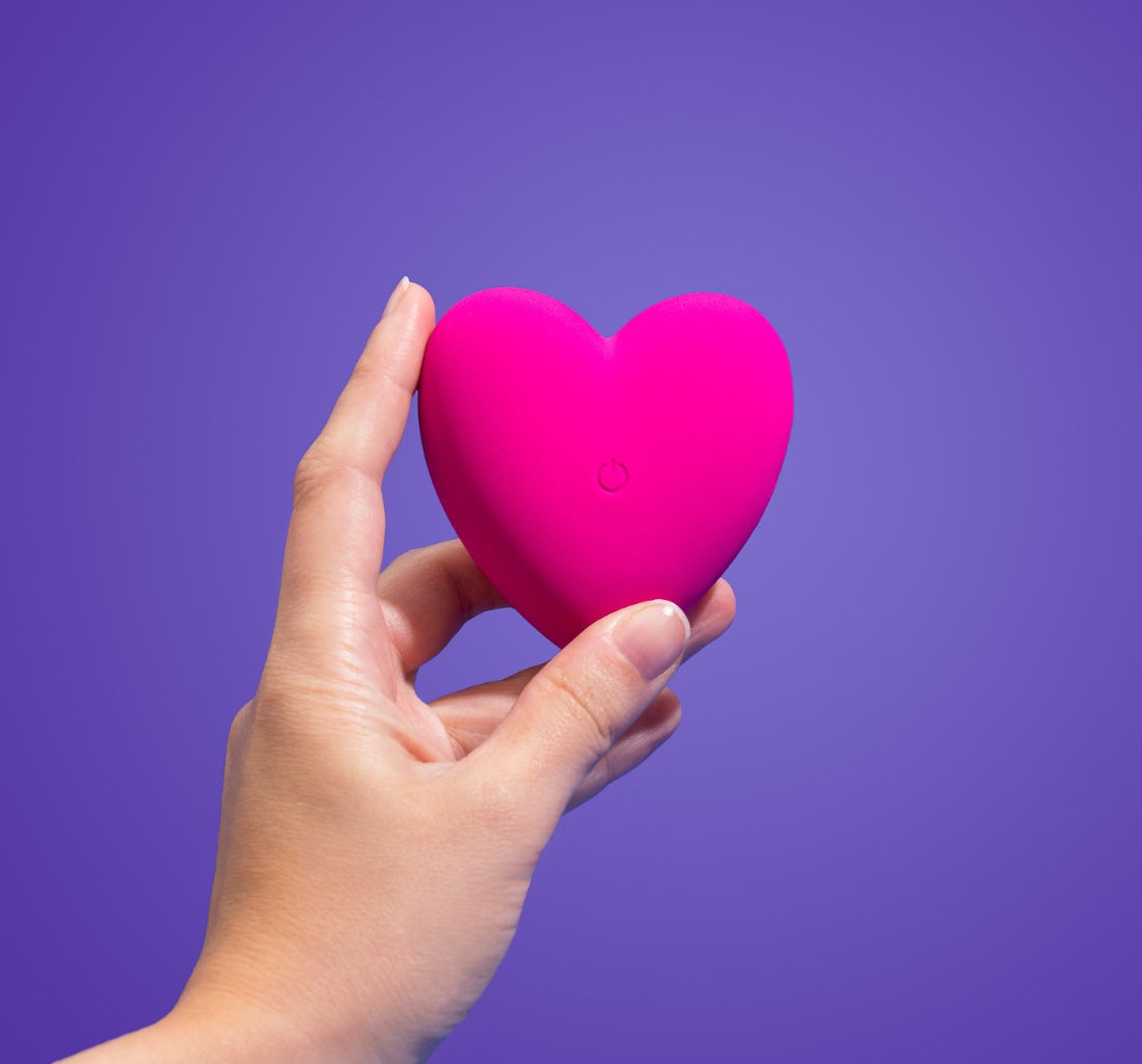 So Divine Je t’aime Heart Vibrator held in hand – compact, soft-touch vibrator offering powerful vibrations in a romantic heart shape.