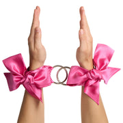 So Divine Silk Clip-On Bondage Restraints Handcuffs in Pink – soft satin cuffs with secure clips, perfect for gentle restraint play.
