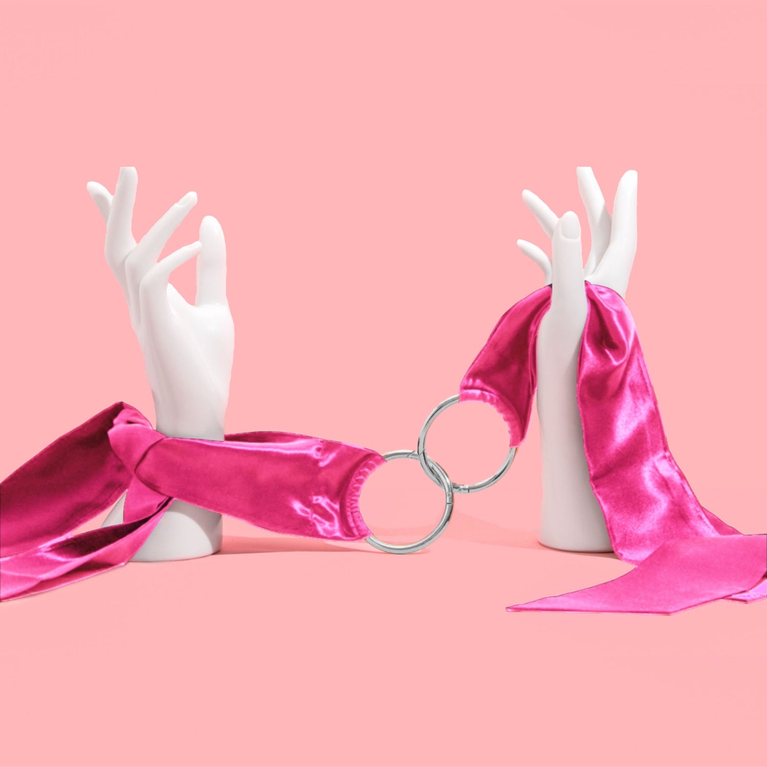So Divine Pink Silk Handcuffs with clip-on detail – soft, adjustable restraints designed for comfort and seduction.