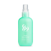 A bottle of Pristine Antibacterial Sex Toy Cleaning Spray with a green label and cap, featuring the brand logo 'So Divine' in white.