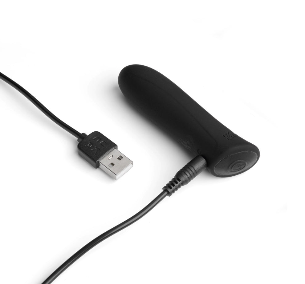 So Divine Wonder Bullet Vibrator in Black connected to USB charger – rechargeable and easy to power up for pleasure on demand